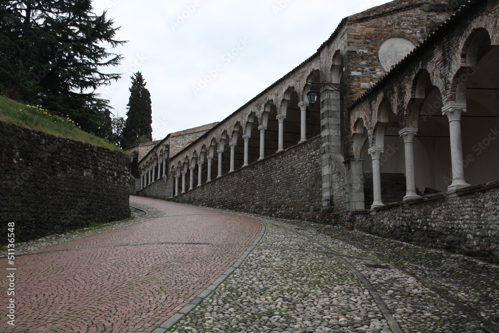 long uphill porches that lead up to the castle of udine city