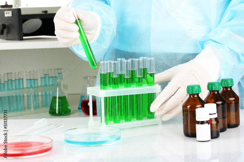 Scientist conducting research in laboratory close up Scientist conducting research in laboratory close up