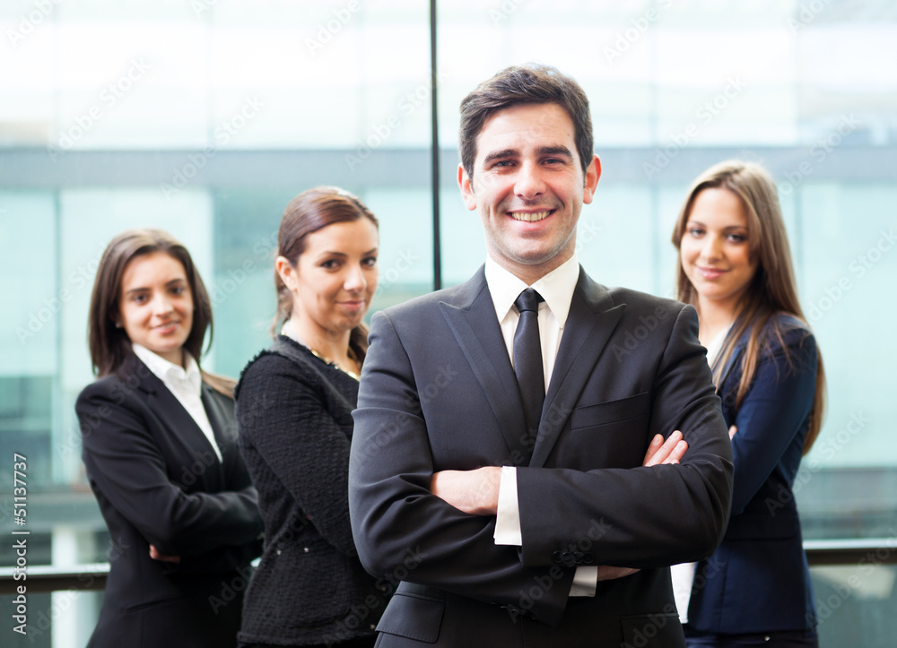 Businessman leader on the foreground of his team Businessman leader on the foreground of his team