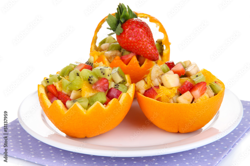 Fruit salad in hollowed-out orange isolated on white Fruit salad in hollowed-out orange isolated on white