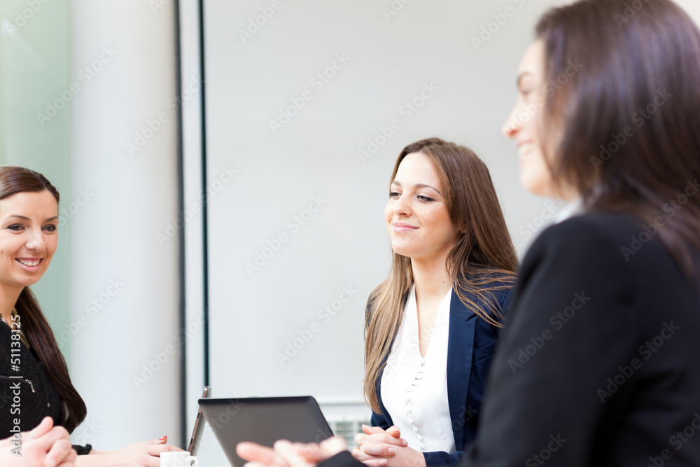 Group of happy business people in a meeting at office Group of happy business people in a meeting at office