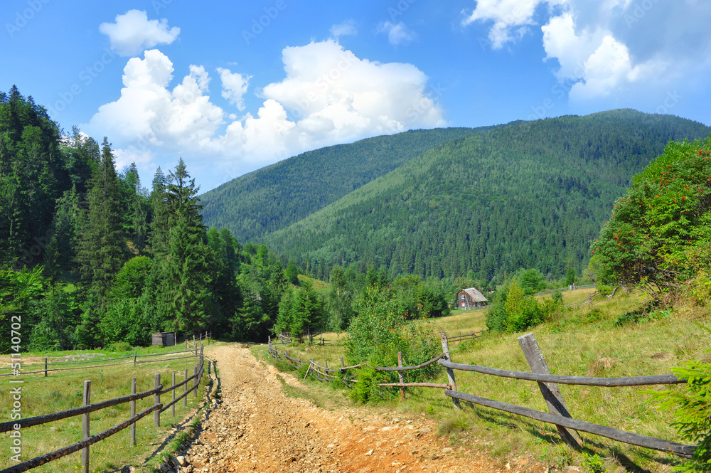 Dirt road and beautiful mountain landscape. Carpathian, Ukraine.