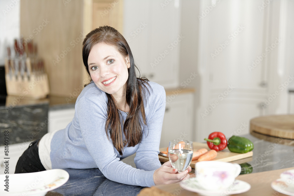 Woman preparing a meal in the kitchen Woman preparing a meal in the kitchen