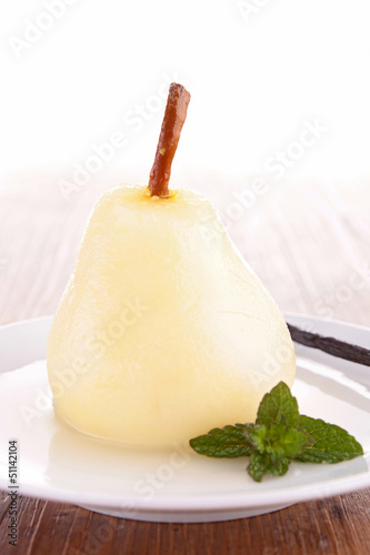 poached pear with syrup photo