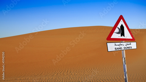 Sand dune with sign