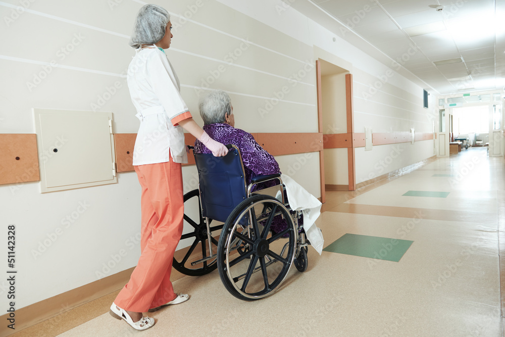 Nurse with elderly patient in wheelchair Nurse with elderly patient in wheelchair