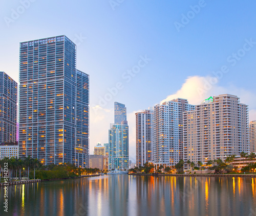 Miami Florida  Brickell and downtown financial buildings over Miami River on a beautiful summer day before sunset