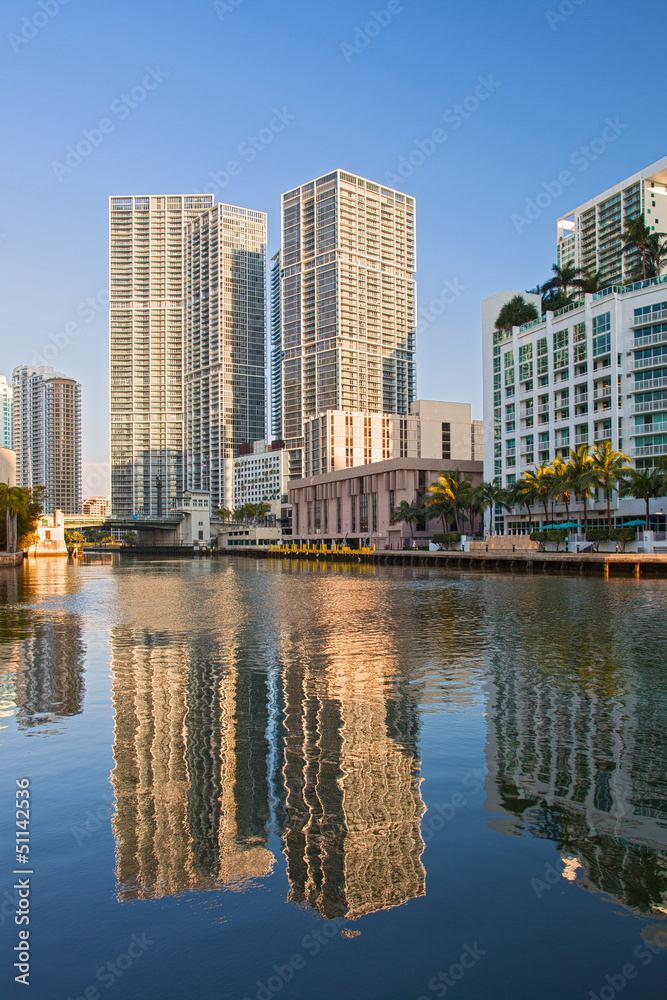 Miami Florida, Brickell and downtown financial buildings reflected over miami River on a beautiful summer day with blue sky