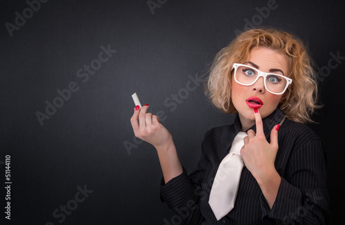 Ignoramus professor woman with chalk, know-nothing concept photo
