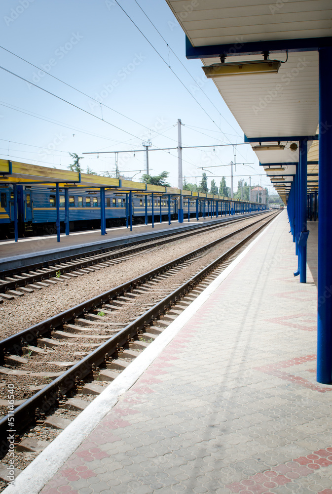 Train track, railway station or platform.
