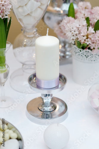 White candle with silk ribbon