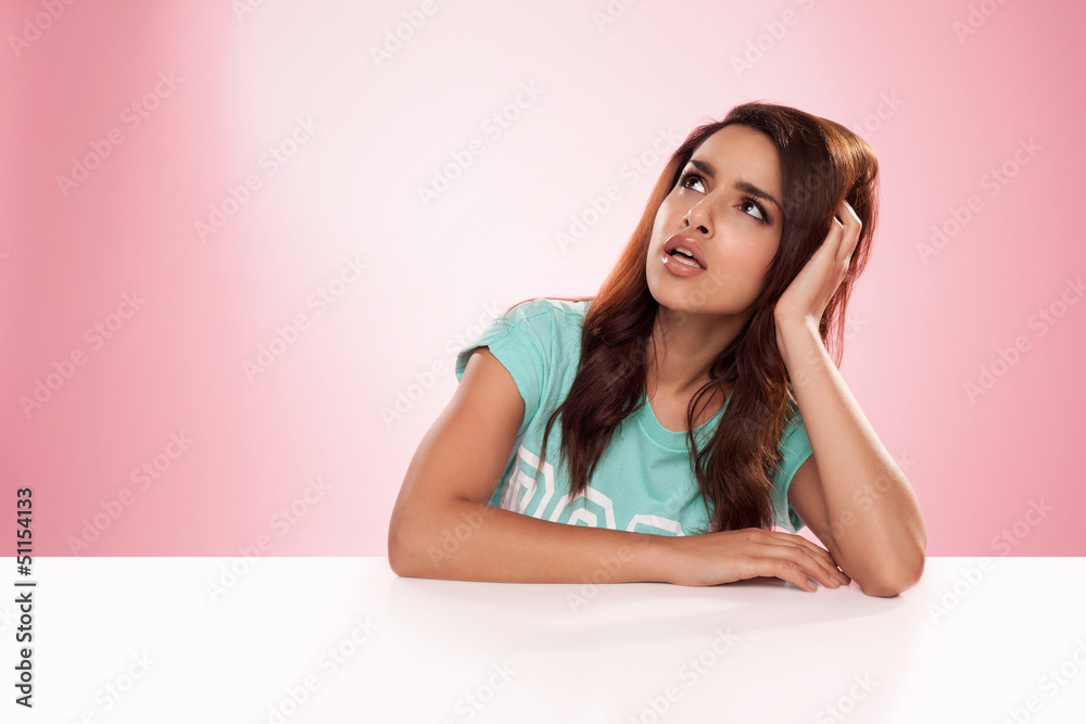 Beautiful woman sitting thinking