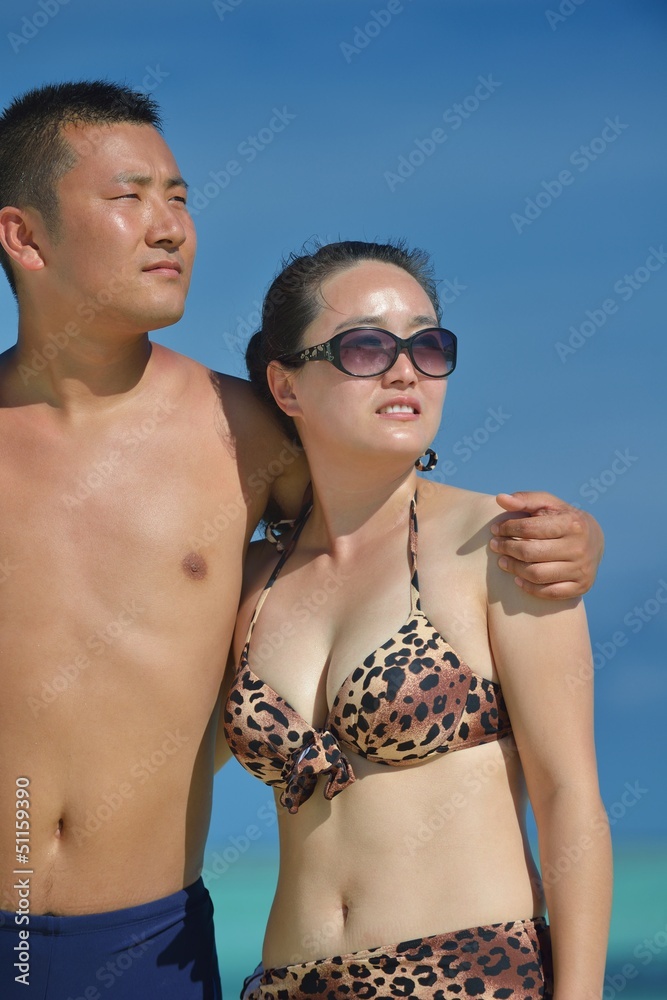 happy young couple enjoying summer on beach happy young couple enjoying summer on beach