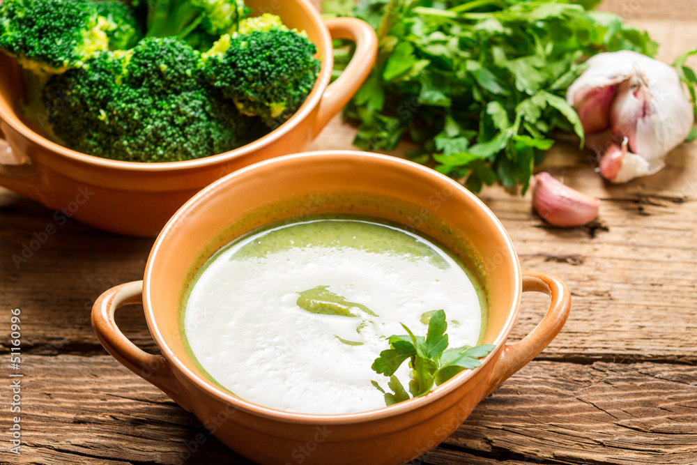 Closeup of broccoli soup made of fresh vegetables, garlic and pa Closeup of broccoli soup made of fresh vegetables, garlic and pa