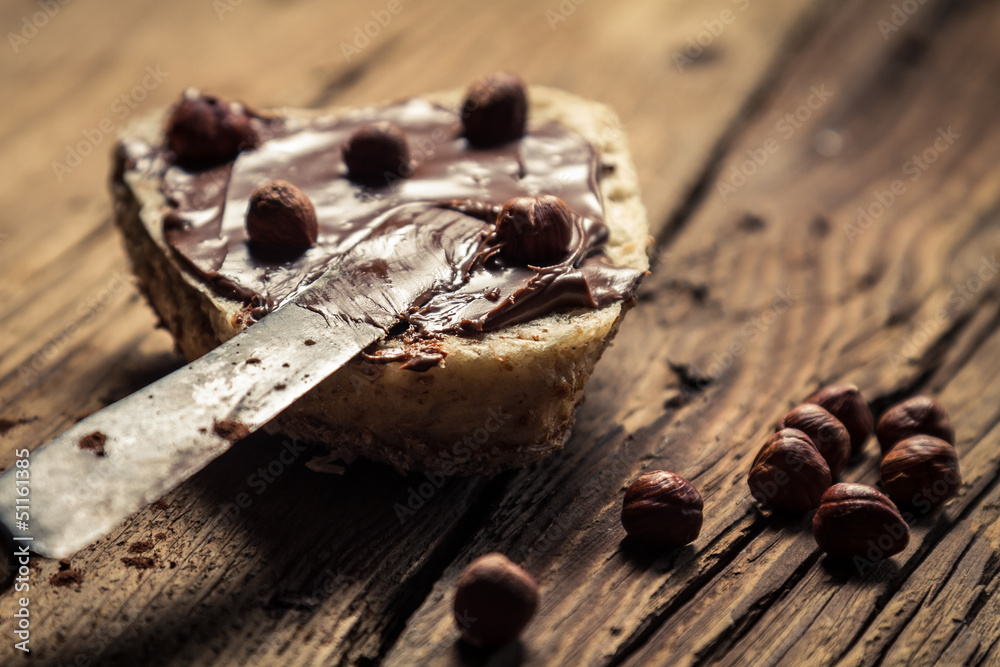 Closeup of sandwich with peanut butter and hazelnuts Closeup of sandwich with peanut butter and hazelnuts