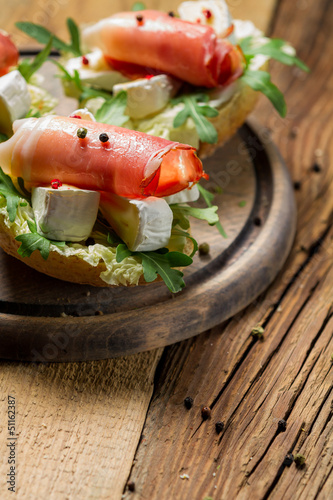 Fresh sandwiches on a old wooden cutting board background 2