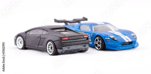 Two toy car on a white background.