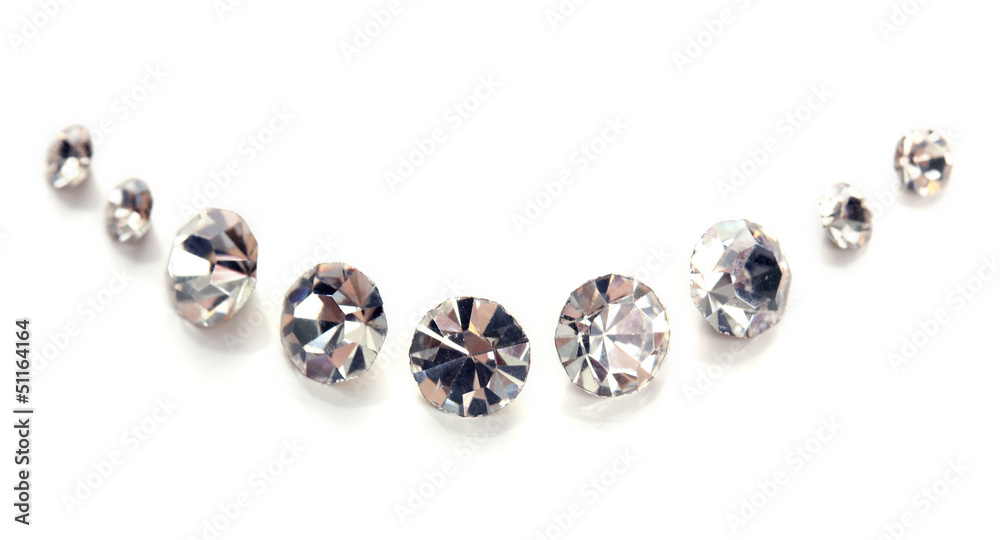 Beautiful shining crystals (diamonds), isolated on white Beautiful shining crystals (diamonds), isolated on white