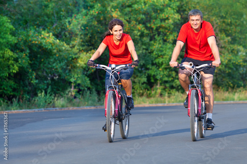 mature couple on bicycle