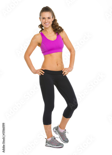 Full length portrait of happy fitness young woman © Alliance