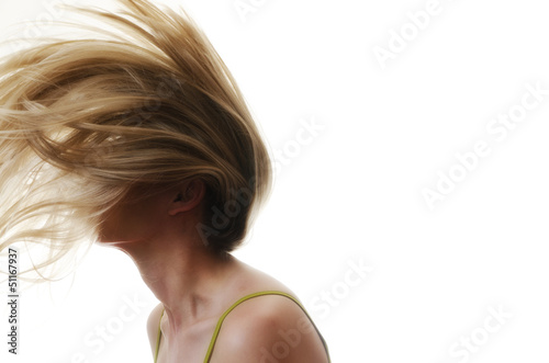 woman with hair flying in the air on white background