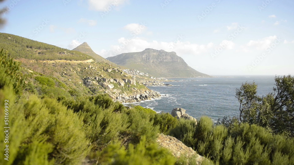 Rocky landscape hill covered with green grass and bushes in Sou