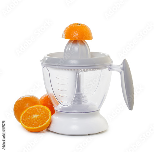 juice extractor with  ripe oranges
