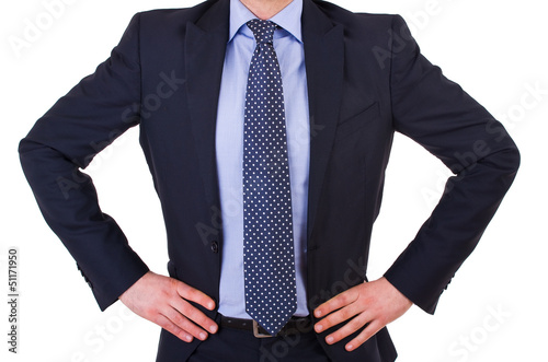 Businessman with hands on his hips.