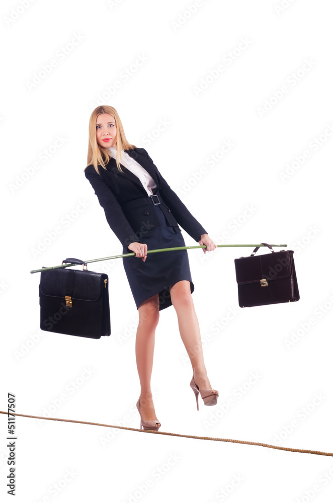 Businesswoman walking on tight rope isolated Businesswoman walking on tight rope isolated
