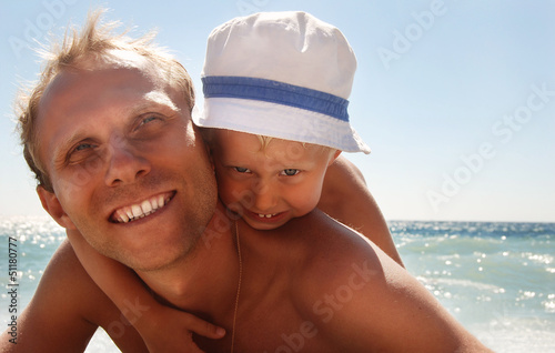 Happy father with son at the sea side