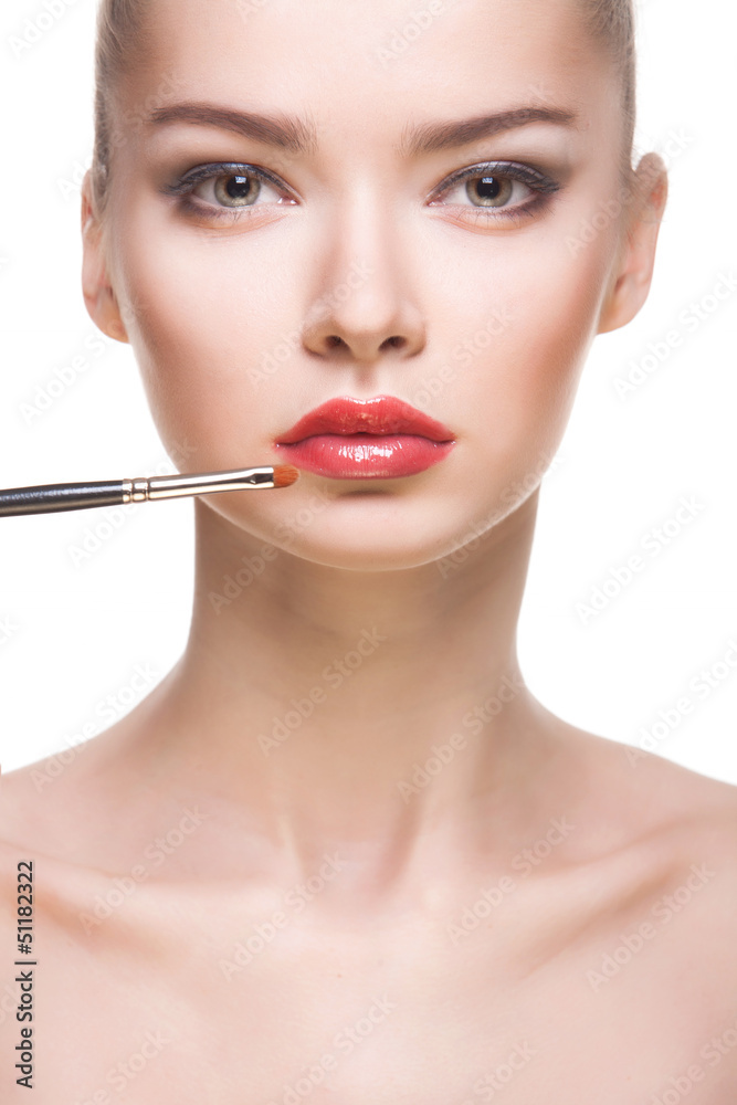 portrait of woman with lips-brush