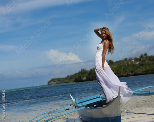 outdoor portrait of young beautiful woman bride in wedding dress