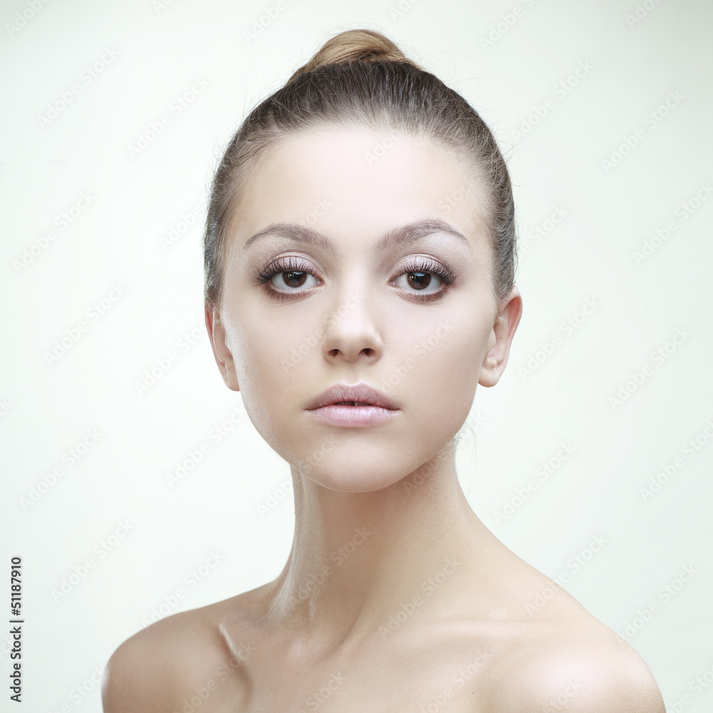 Fototapeta premium beautiful girl with perfect skin on a light background