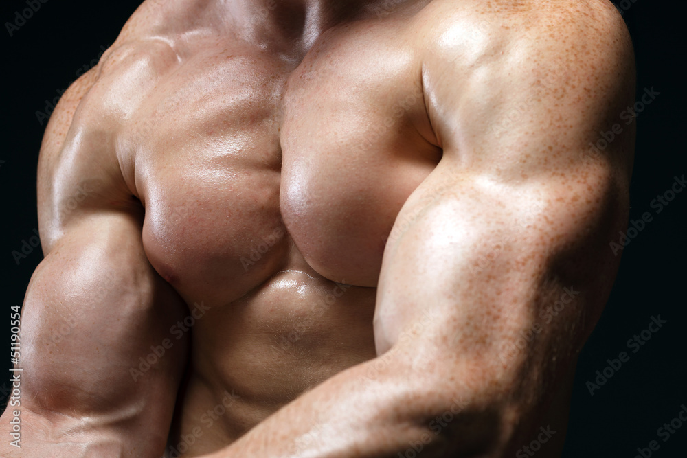 Cropped picture of muscle man posing in studio Cropped picture of muscle man posing in studio