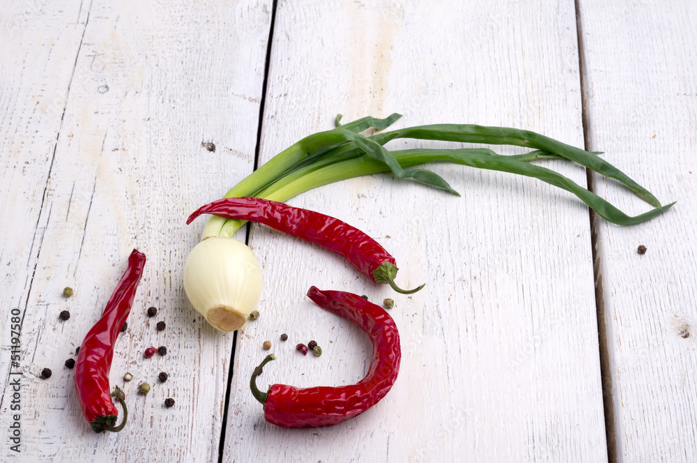 Green onions and red peppers spicy, colorful pepper Green onions and red peppers spicy, colorful pepper