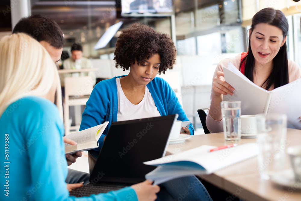 Students sitting at the table and study Students sitting at the table and study
