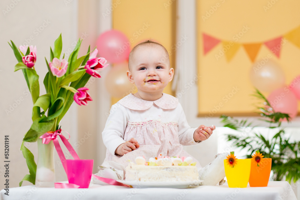 baby girl celebrating birthday and eating cake baby girl celebrating birthday and eating cake