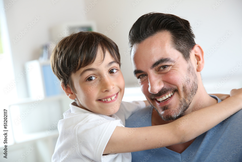 Obraz premium Portrait of father and son relaxing at home