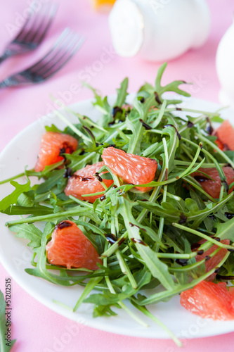 salad with fresh arugula and slices of citrus