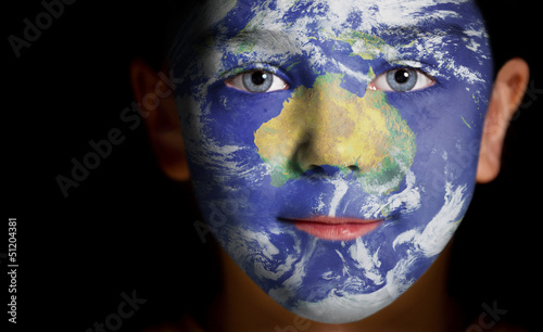 Portrait of a child with a painted Australia.