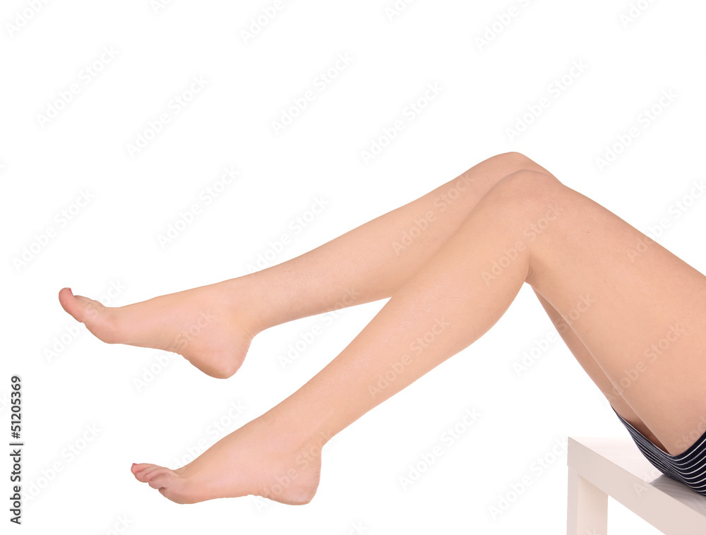 Long pretty woman legs, isolated on white.