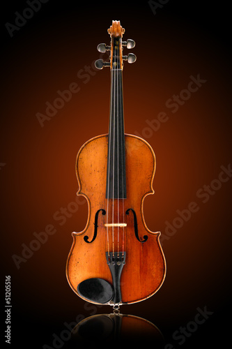 antique violin on brown background