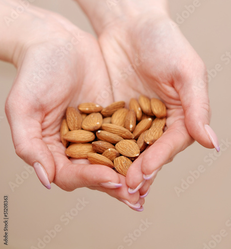 almonds in female hands