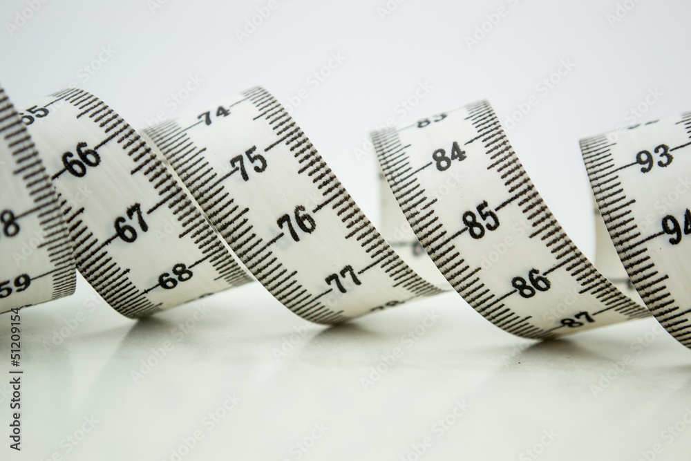 Measure tape or centimeter isolated over white Measure tape or centimeter isolated over white