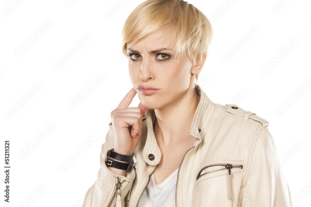 short hair blonde girl has a toothache on white background