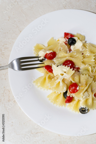 Pasta ribbons, cherry tomatoes and olives
