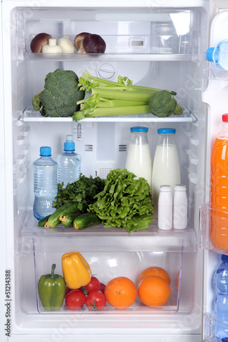 Open refrigerator with vegetarian food