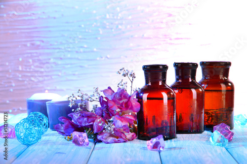 Fototapeta Naklejka Na Ścianę i Meble -  Spa oil and freesia on light background