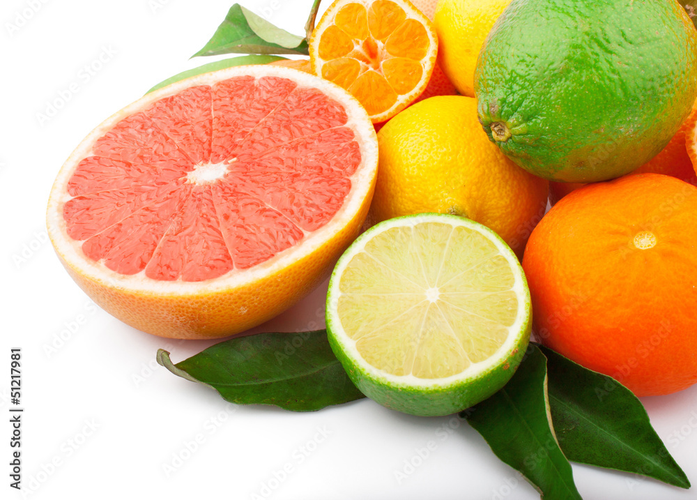Fresh citrus fruits whole and half with green leaves, food Fresh citrus fruits whole and half with green leaves, food