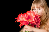 Little girl with tulips bouquet